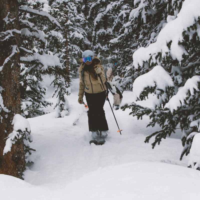 Female skier in high-quality ski gear from Sun & Ski Sports.